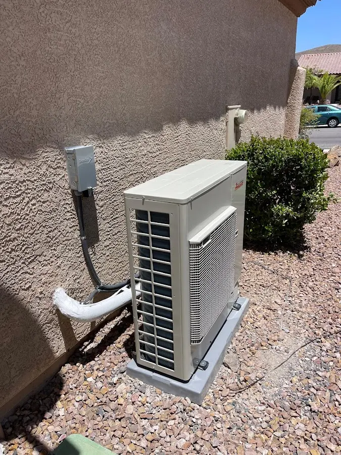 Residential air conditioning condenser unit in Chickasaw